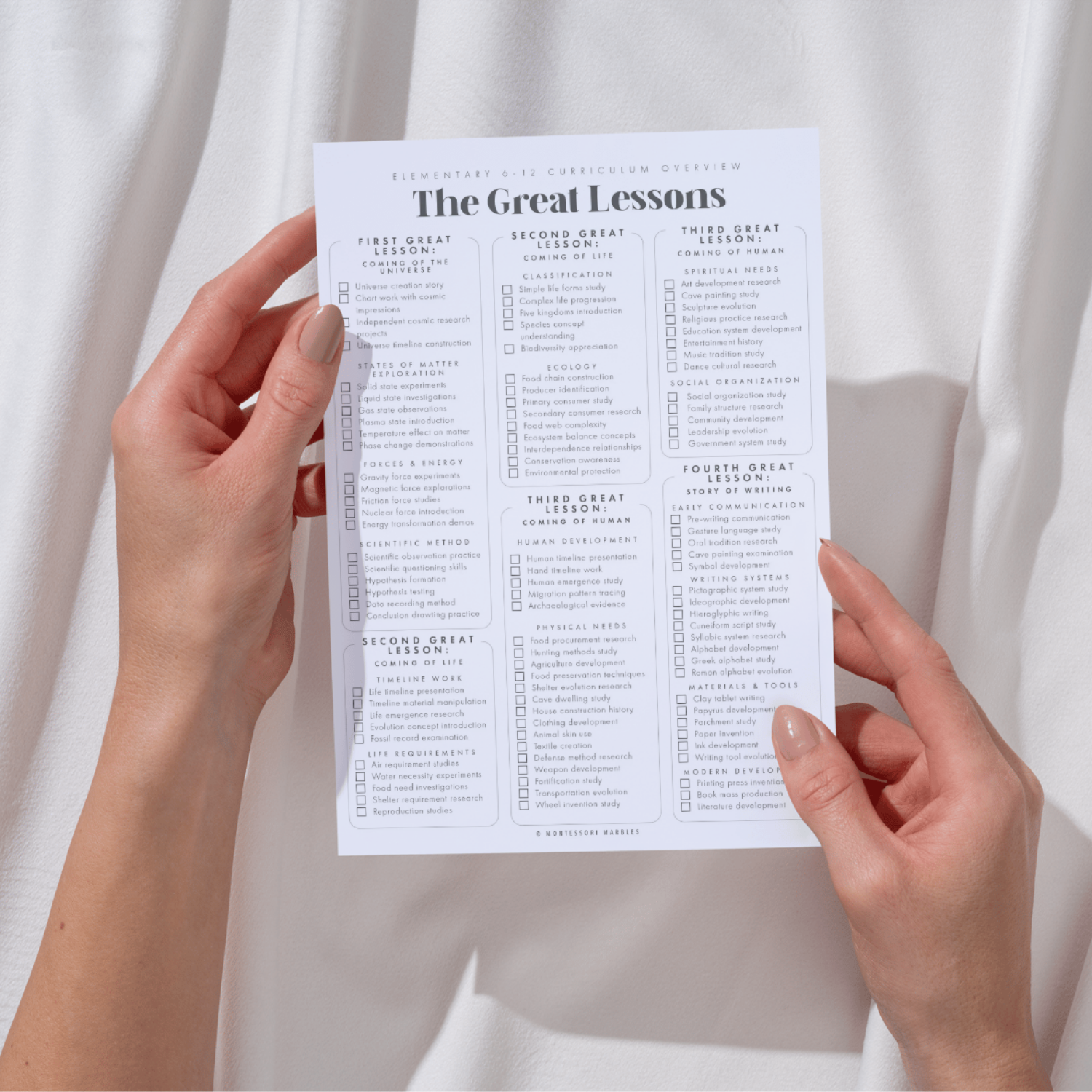 A guide holding the Great Lessons checklist page from the ages 6 to 12 Montessori curriculum
